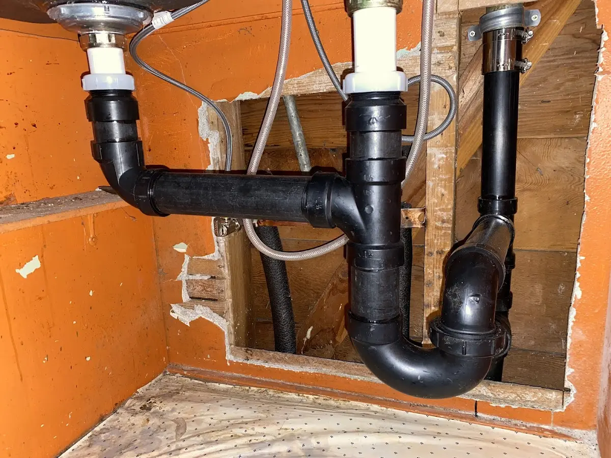 Professional Garbage Disposal Repair equipment and tools on the job in Bellair-Meadowbrook Terrace